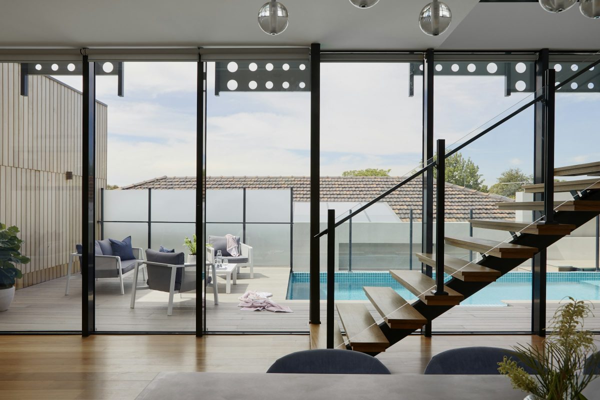 Floor-to-ceiling glazing and a floating staircase