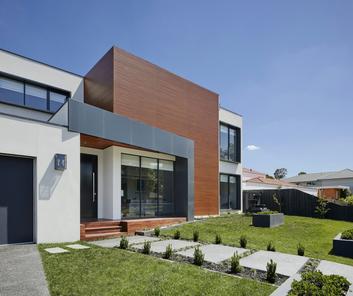 Contemporary residence with timber and white facade