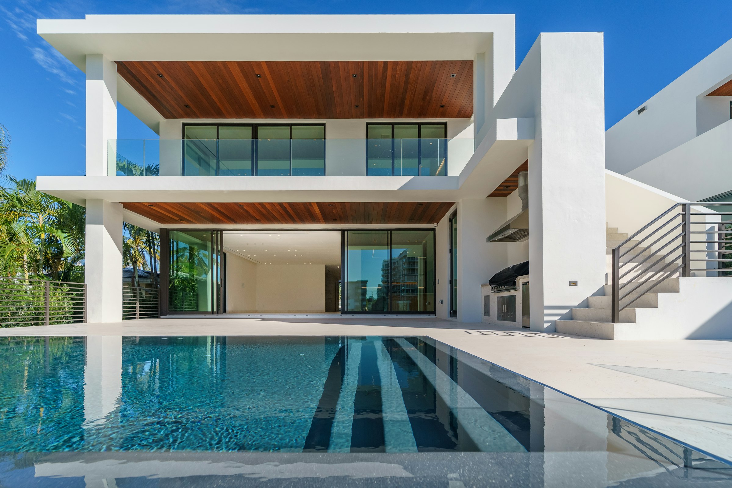 Modern villa with a cantilevered upper floor and pool