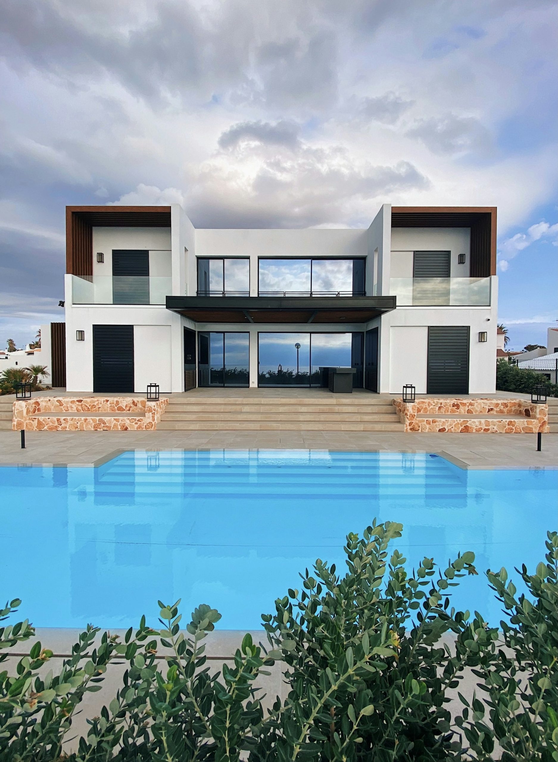 Villa terrace overlooking a swimming pool